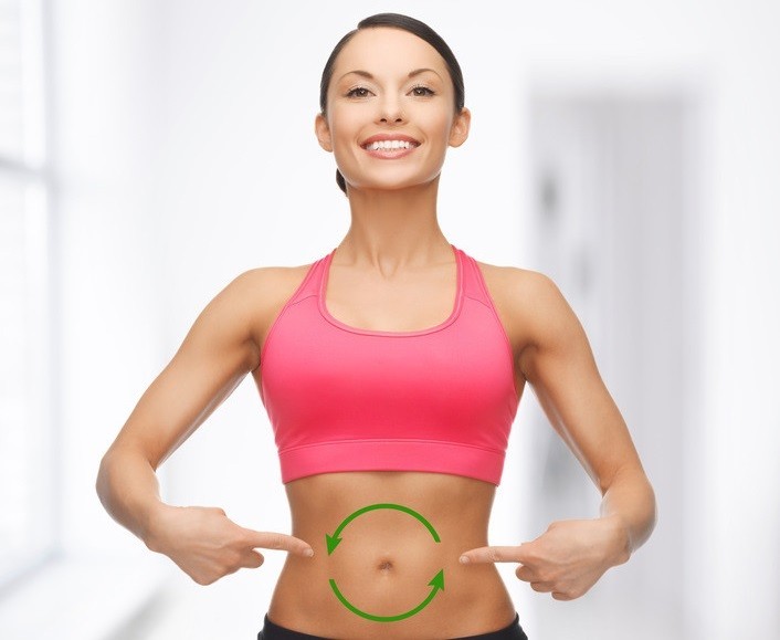 Woman with Green arrows making a circle on her stomach